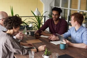 Four people meeting at a table