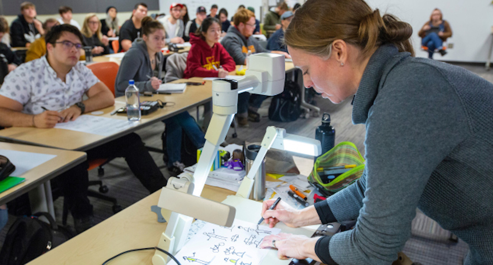 Verena Paepcke-Hjeltness, assistant professor of industrial design, instructs students on how to develop sketchnoting skills. Photo by Christopher Gannon 2018